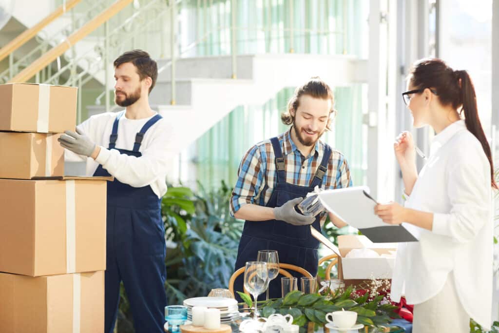 An event organizer speaking with an employee at their event venue 