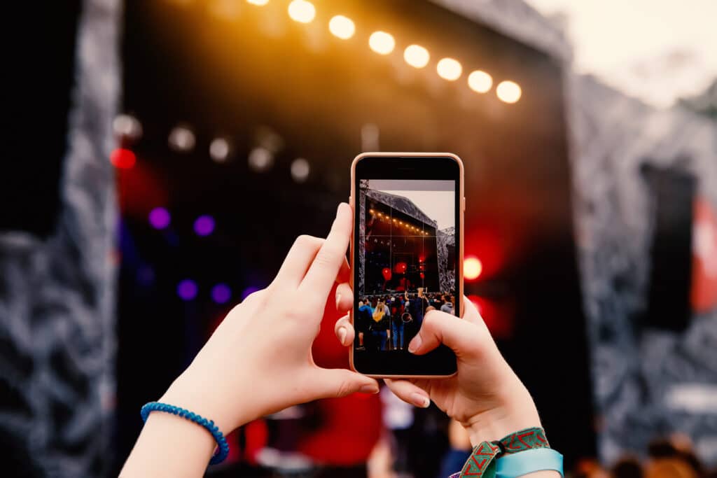 a person filming content for social media on a mobile device 