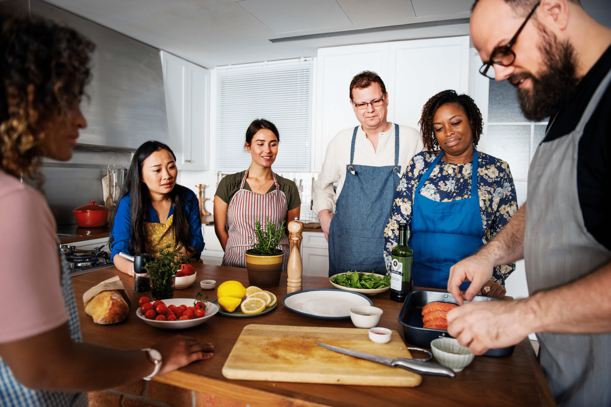 group of adults taking a cooking class