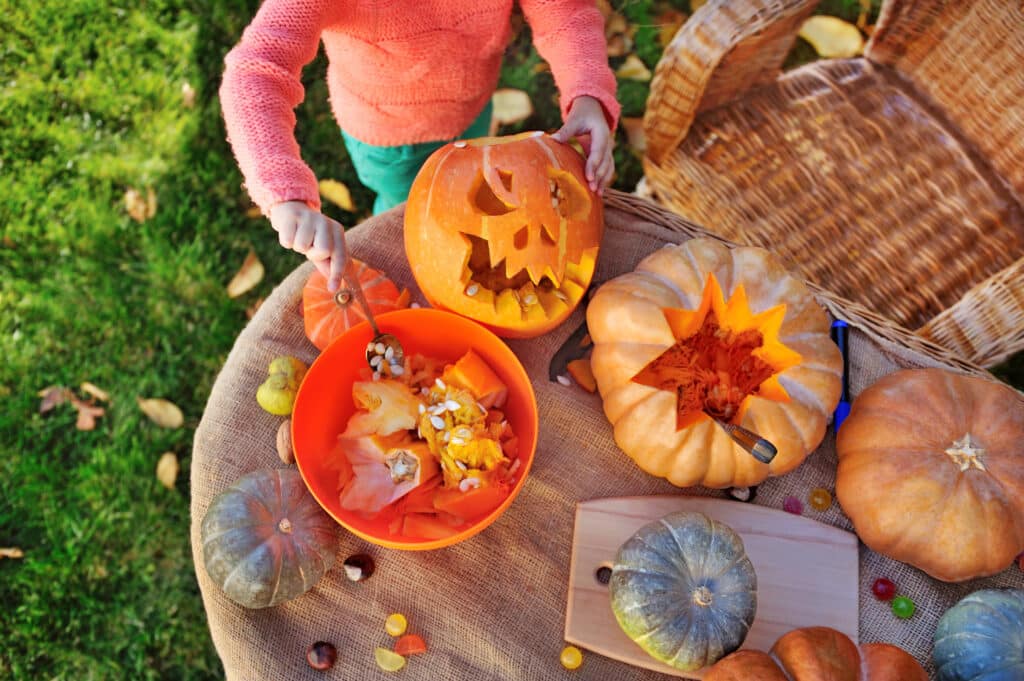 Top view picture of carved pumpkins on a table
