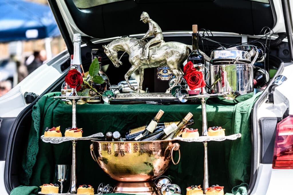 trophy and champagne in the back of a car for tailgating