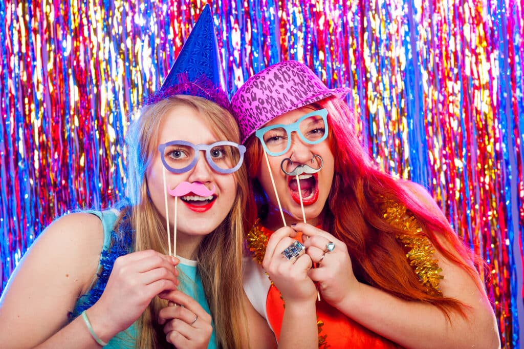 Young nice girls have fun on a dance party