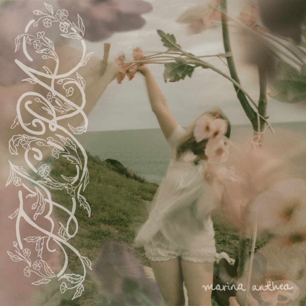 Album cover for FLORA EP by Marina Anthea, featuring white cursive typography and a girl dancing with flowers