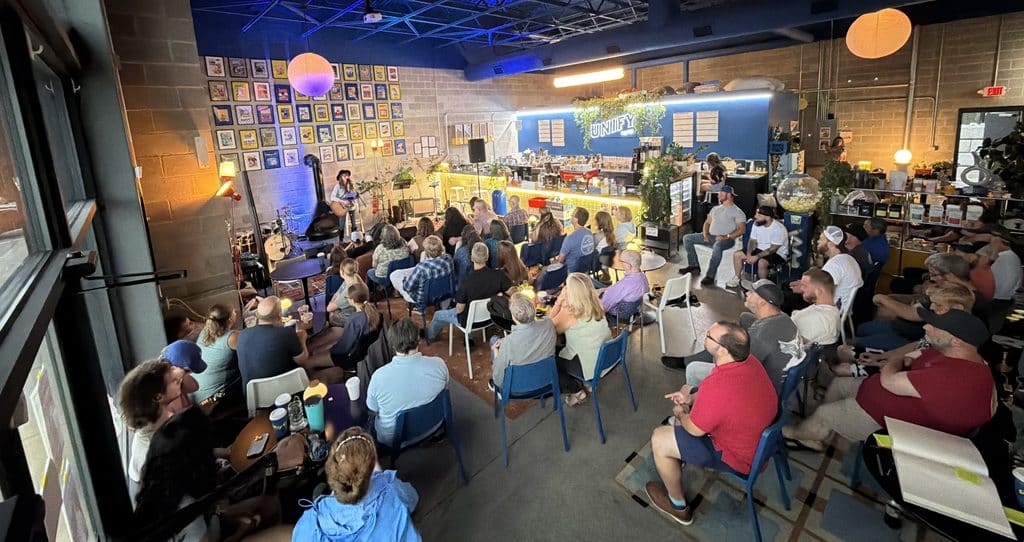 Room full of people at a coffee shop for Aisley Autumn's debut album release show